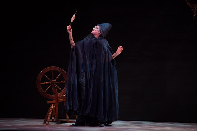 Alice Topp as the Old Woman in "Sleeping Beauty" with a spinning wheel.